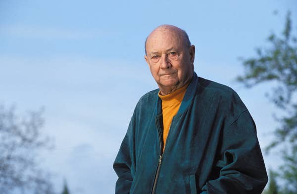 Donald Pleasance wearing casual clothing in Cognac, France
