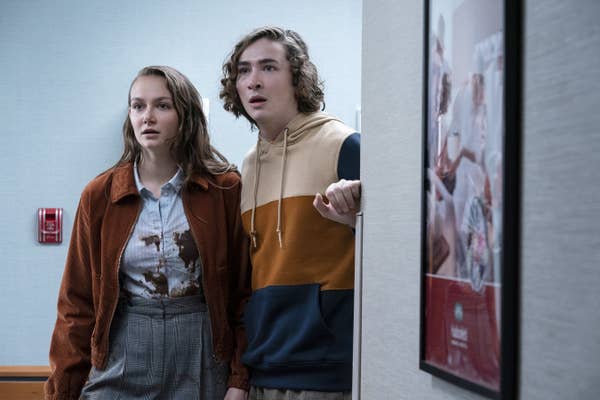 Andi Matichak and Dylan Arnold standing in a hallway in &quot;Halloween Kills&quot;