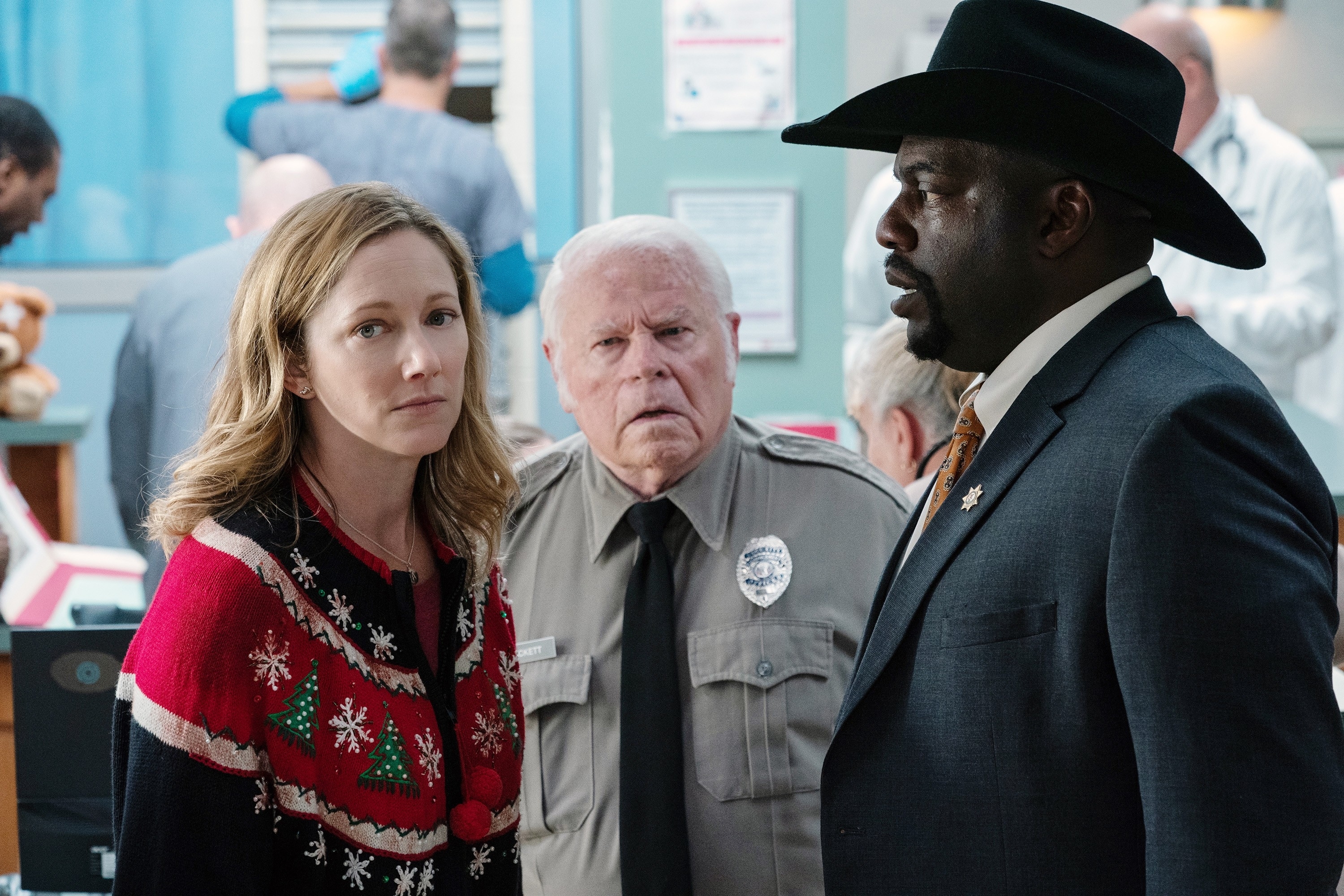 Judy Greer, Charles Cyphers, and Omar J. Dorsey standing in a hospital in "Halloween Kills"