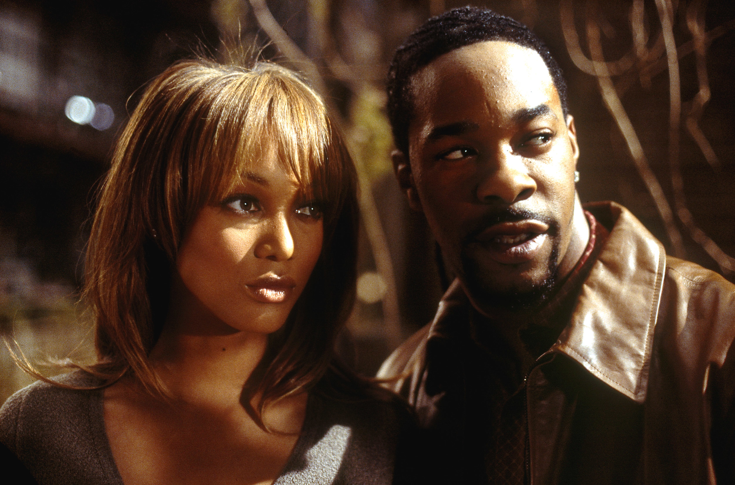 Tyra Banks and Busta Rhymes standing next to each other in "Halloween: Resurrection"