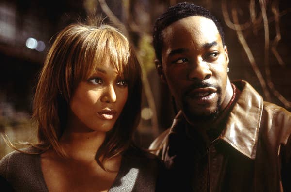 Tyra Banks and Busta Rhymes standing next to each other in &quot;Halloween: Resurrection&quot;