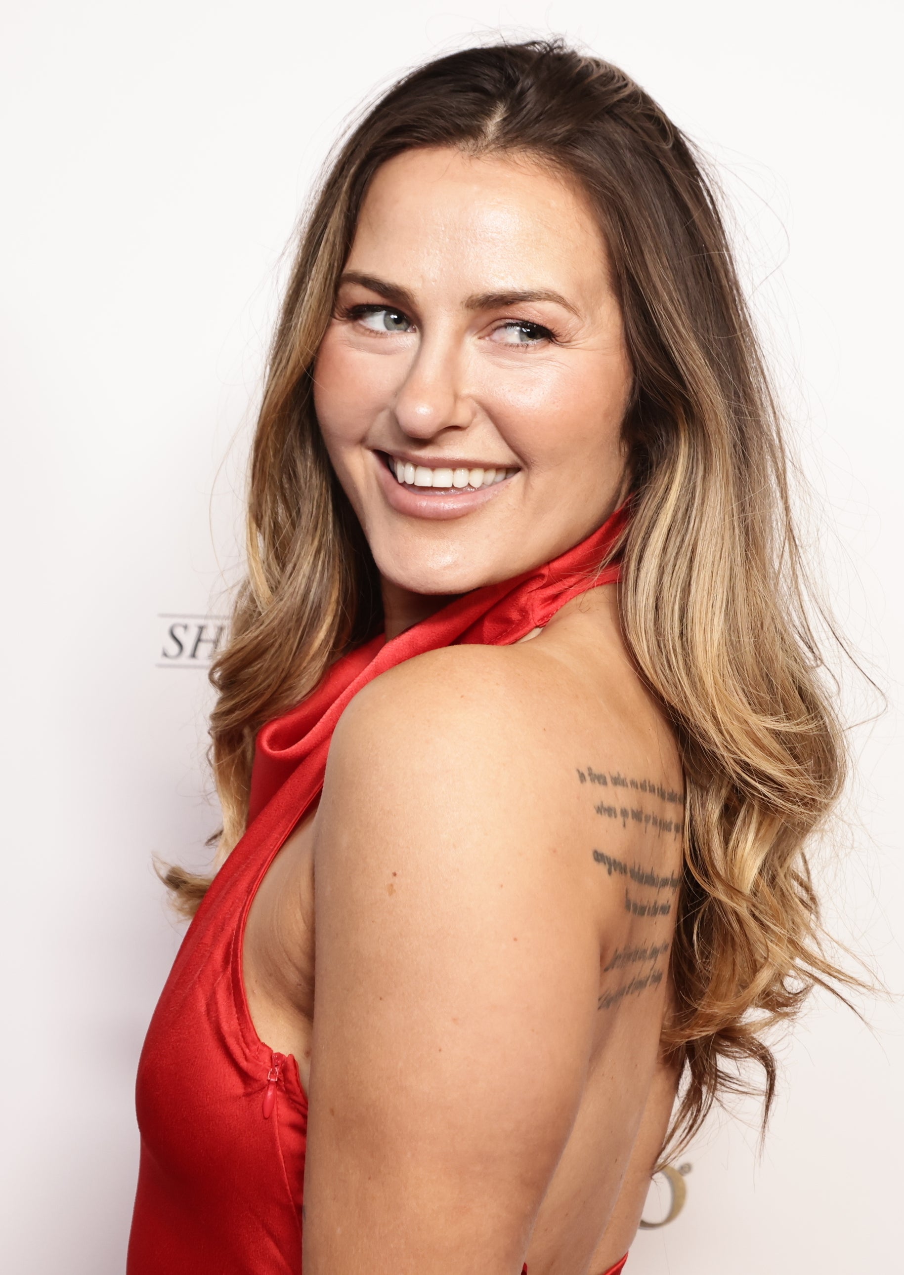 Scout Taylor-Compton wearing a red dress on the red carpet for "The Bay" Season 8 premiere