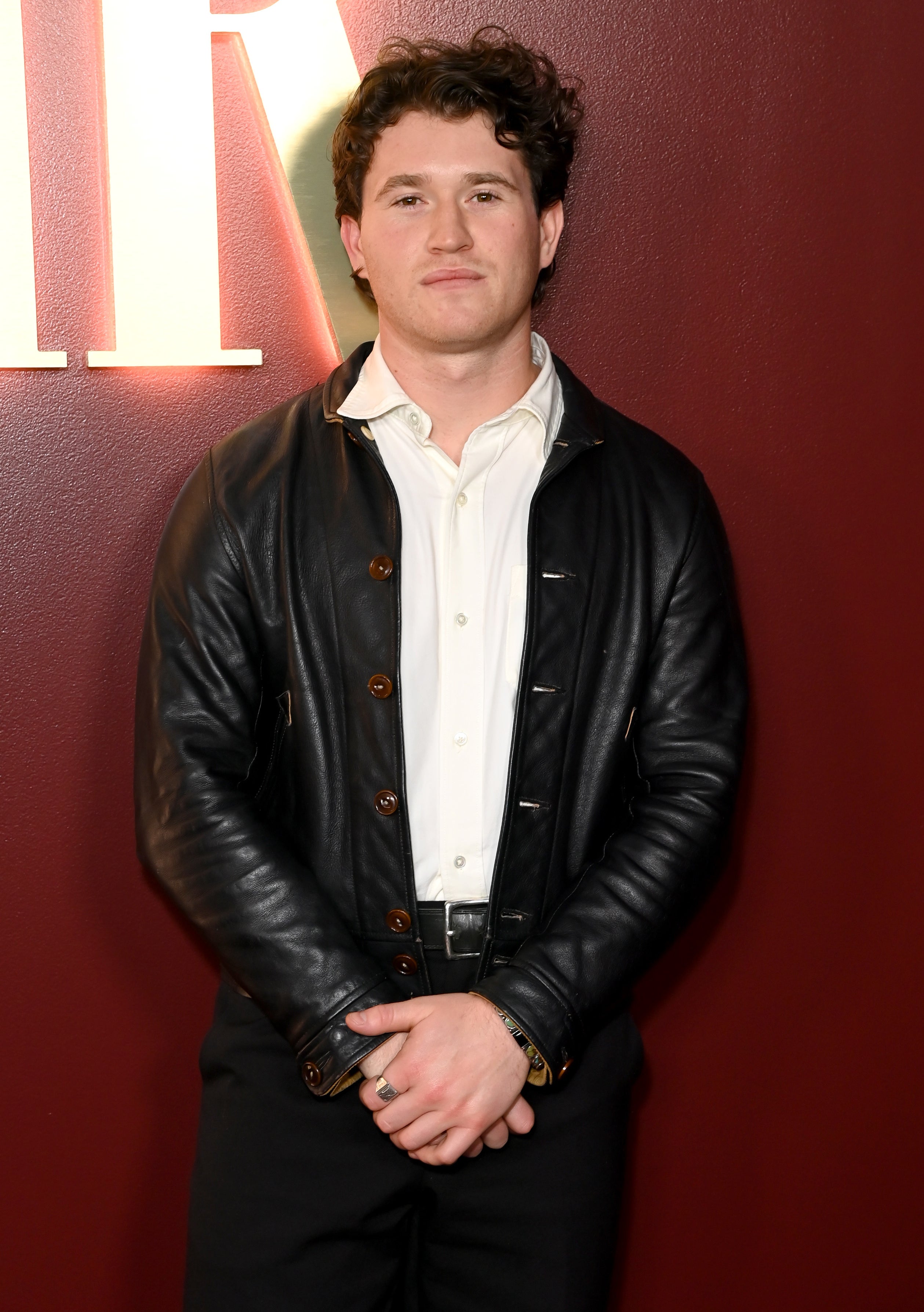Rohan Campbell in a leather jacket, white button-up shirt, and black pants at Vanities: A Night for Young Hollywood