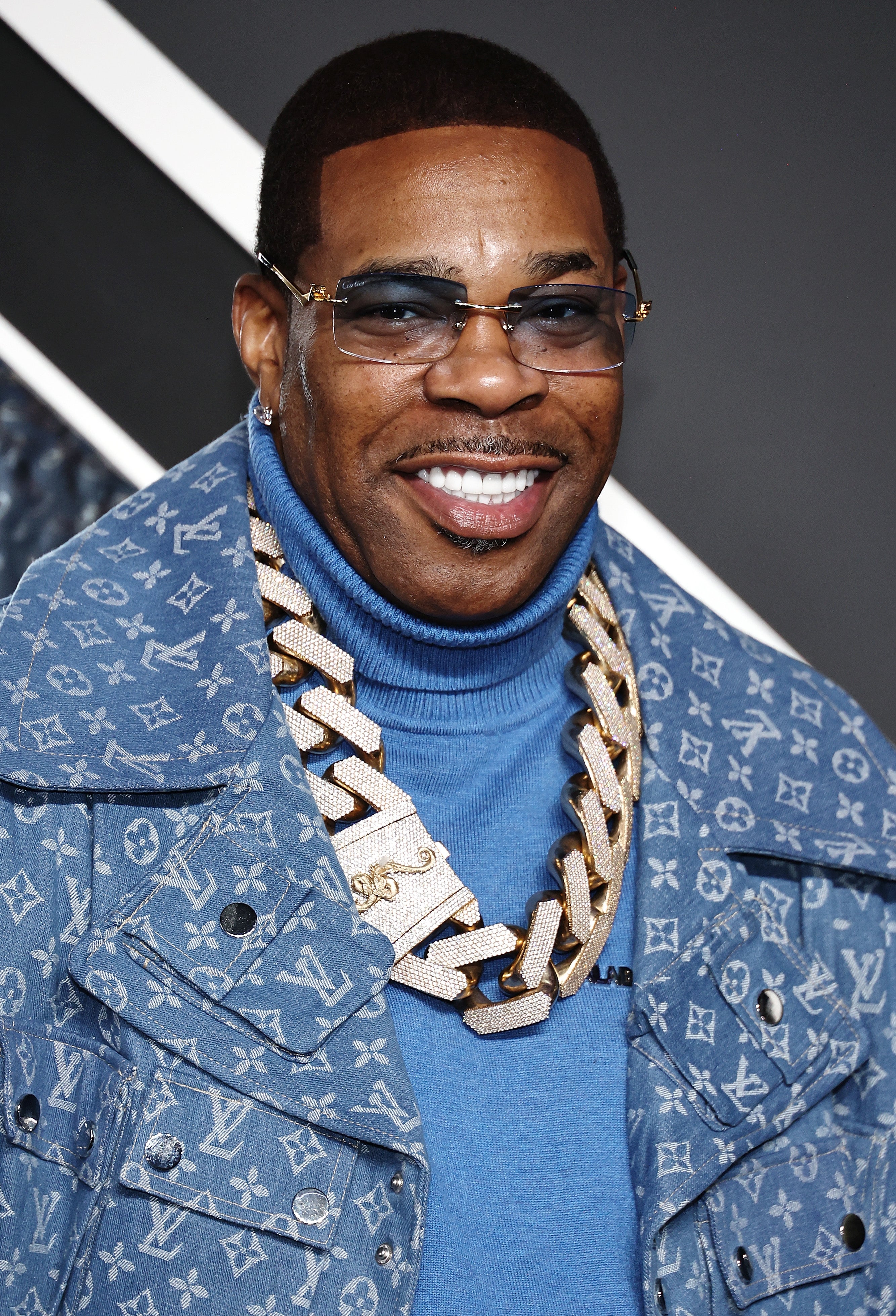 Busta Rhymes wearing a Louis Vutton jacket, big necklace, and blue top at the 2024 MTV Video Music Awards