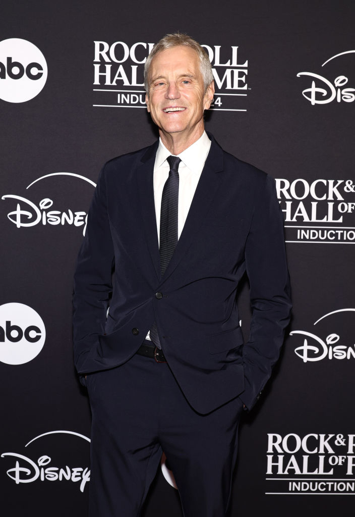 Man in a suit at Rock &amp;amp; Roll Hall of Fame induction red carpet event