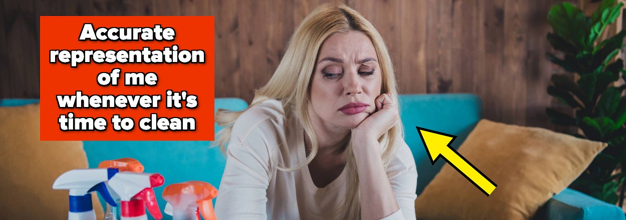 Woman looking bored on couch with cleaning supplies around