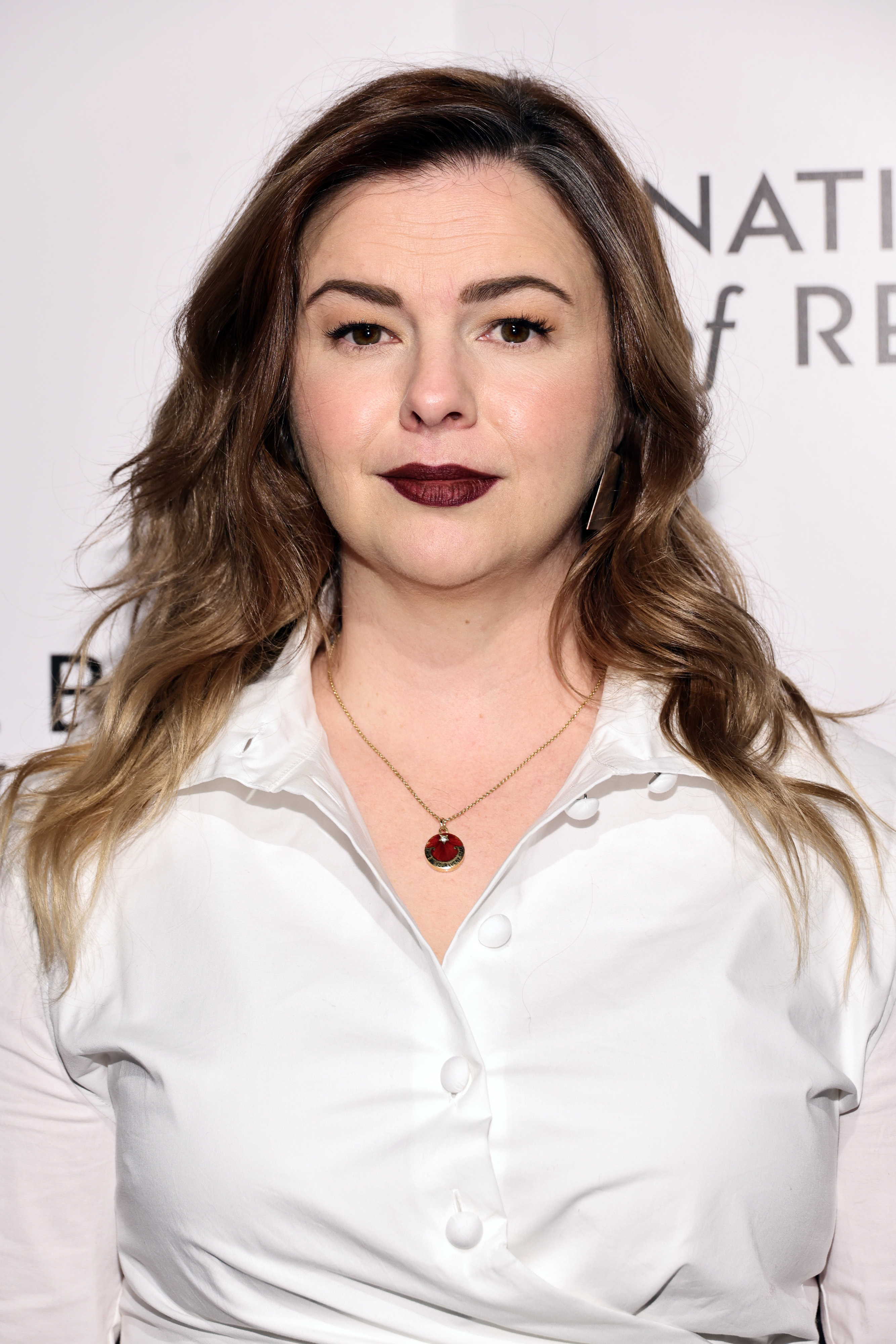 A closeup of Amber Tamblyn in a blouse