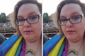 A person wearing glasses, a rainbow scarf, and a rainbow necklace is outdoors