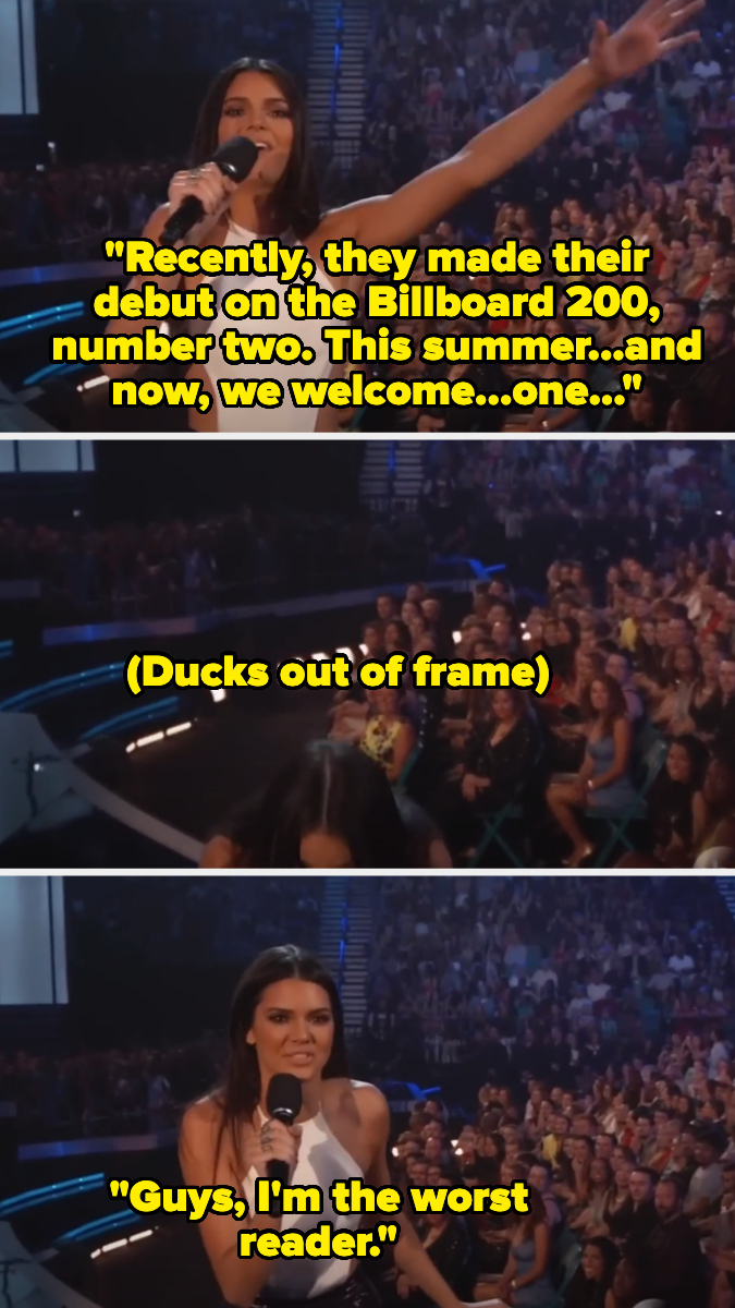 Kendall Jenner hosting an event, speaking to a crowd, momentarily ducks out, then jokes, "Guys, I'm the worst reader."