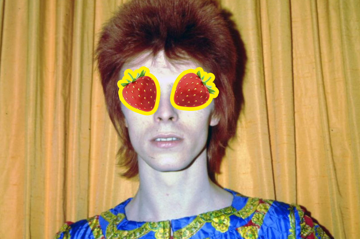 David Bowie in a colorful outfit with a vibrant pattern, and strawberry emojis over his eyes.