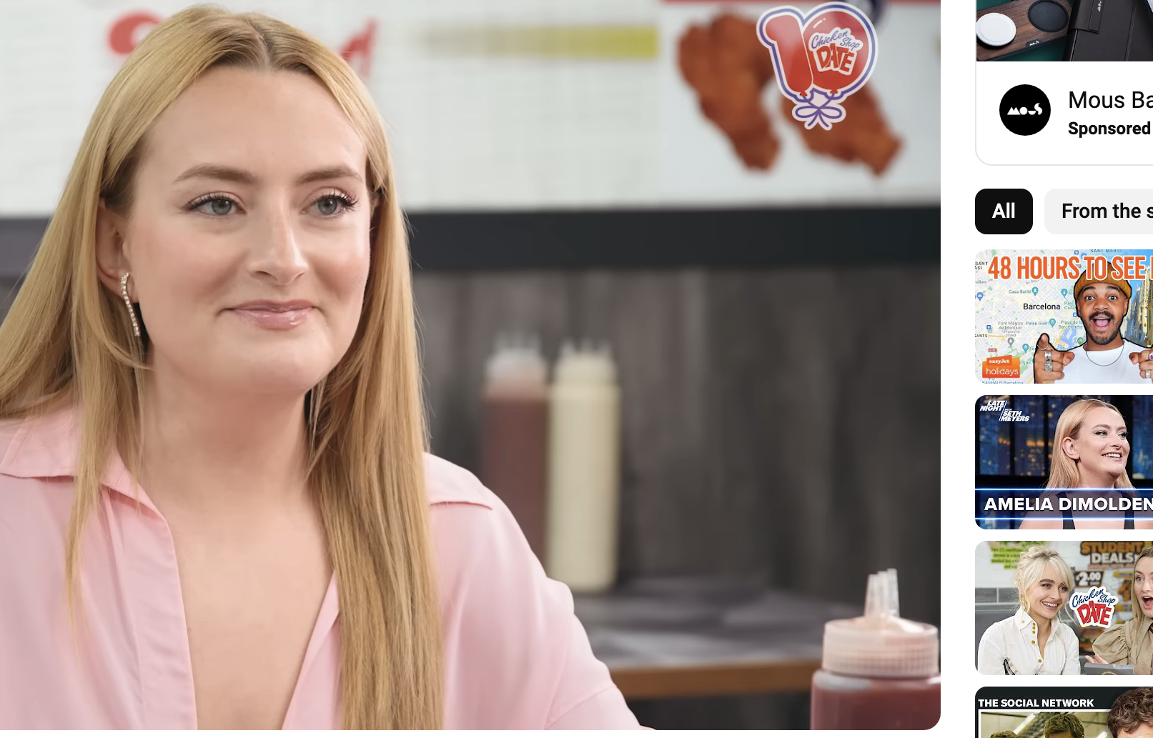 Amelia Dimoldenberg during an interview for &quot;Chicken Shop Date&quot; on YouTube, sitting at a table with condiments visible in the background