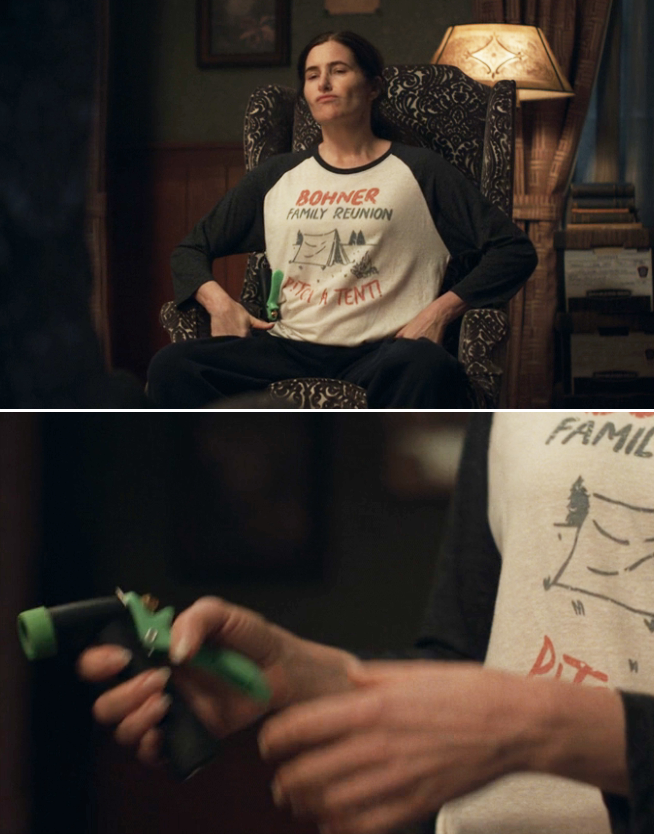 A close-up of Agatha holding a green hose while wearing a &quot;Bohner family reunion&quot; shirt