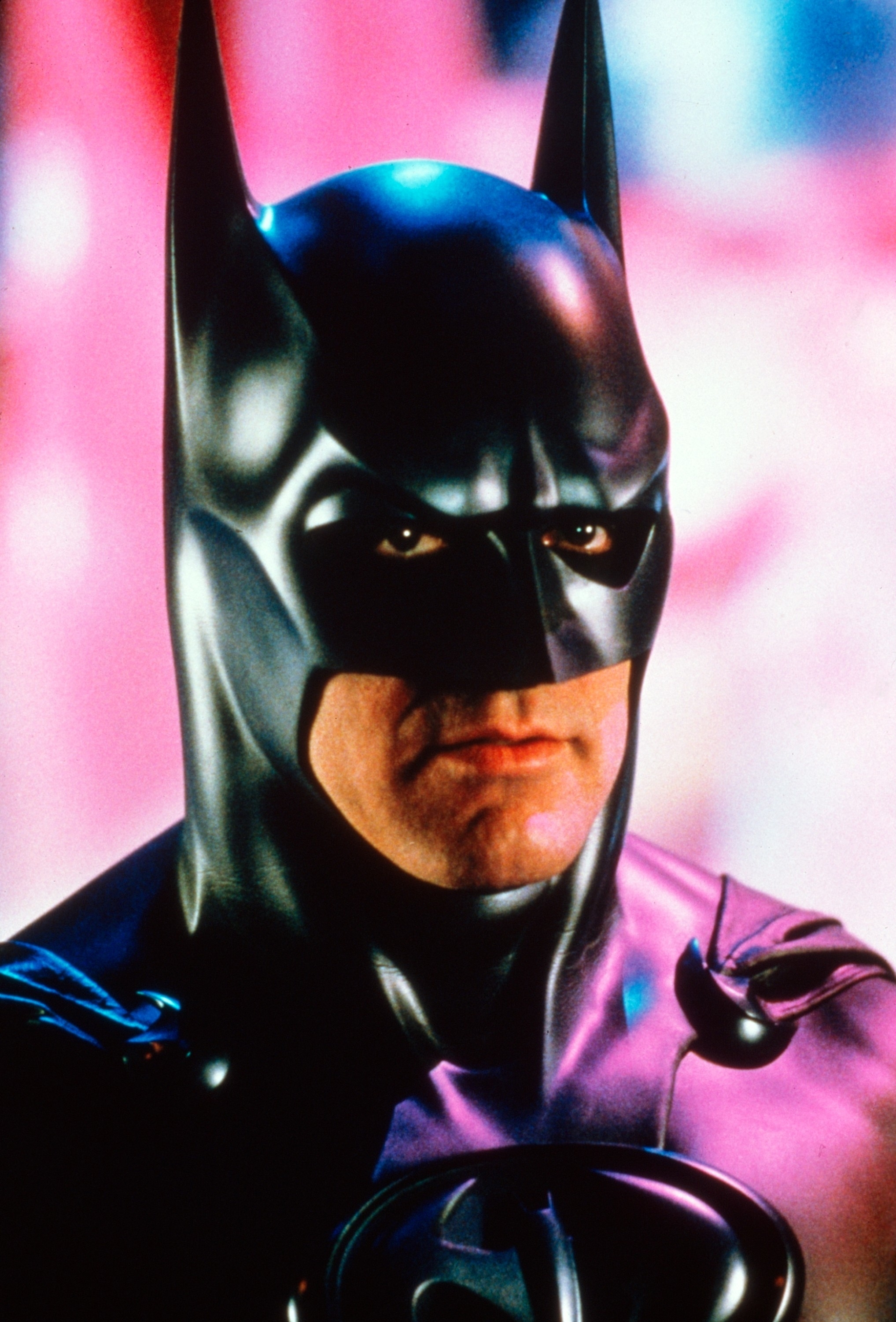 Batman in his iconic suit with a stern expression