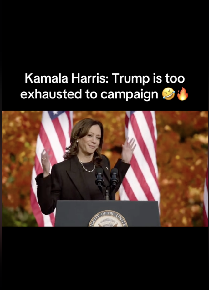 Kamala Harris, speaking at a podium with American flags behind her