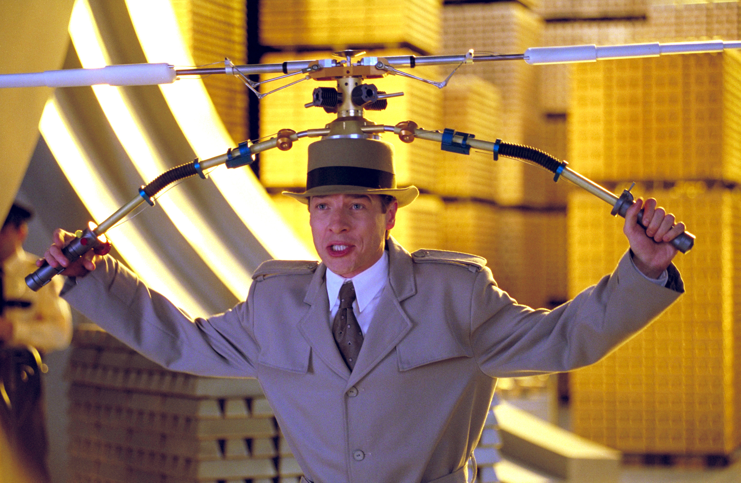 French in a trench coat and hat with copter gadget attached