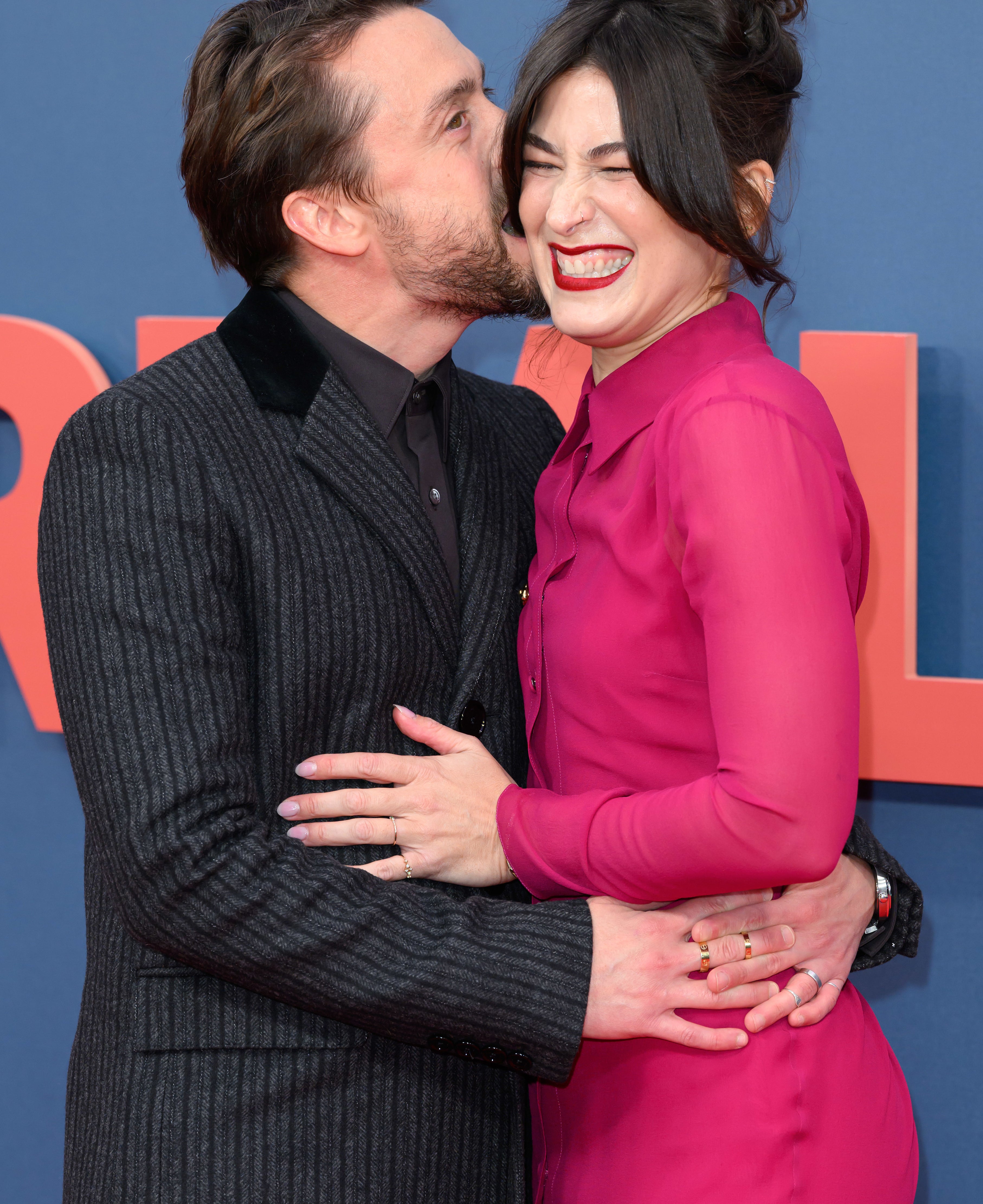 Kieran Culkin kissing his wife Jazz Charton on the cheek