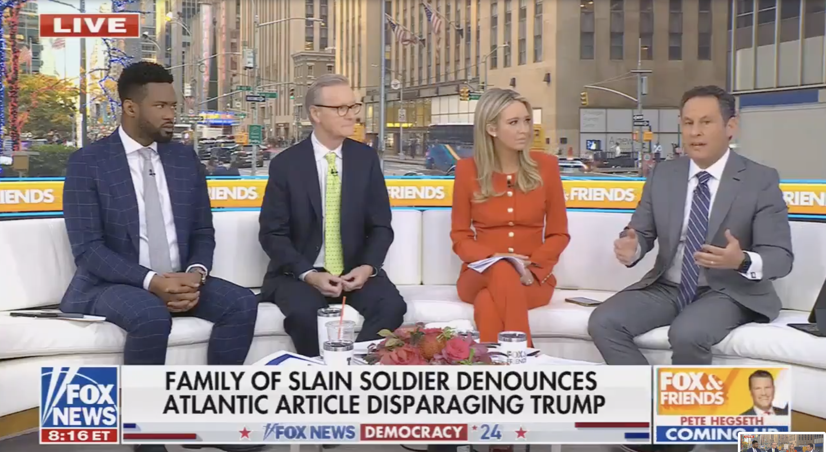 Four news anchors on a couch discuss a story. The text on screen highlights a denouncement of an article disparaging Trump