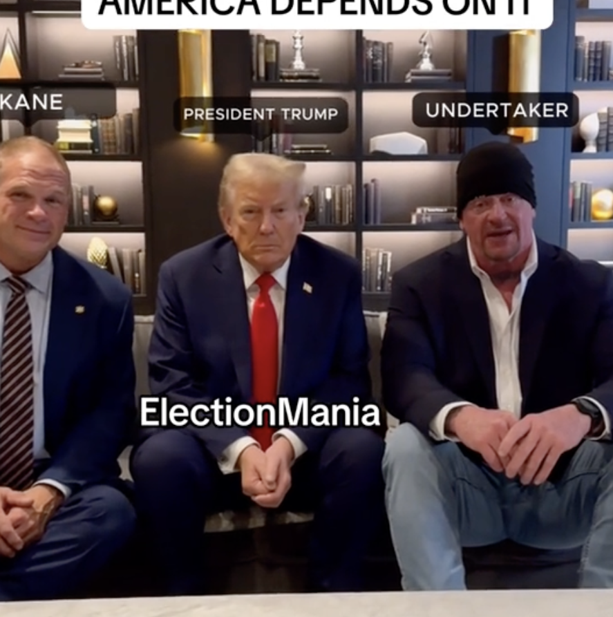 Three men, labeled Kane, President Trump, and Undertaker, sit together on a couch. Text above reads &quot;America Depends On It&quot; and &quot;ElectionMania.&quot;