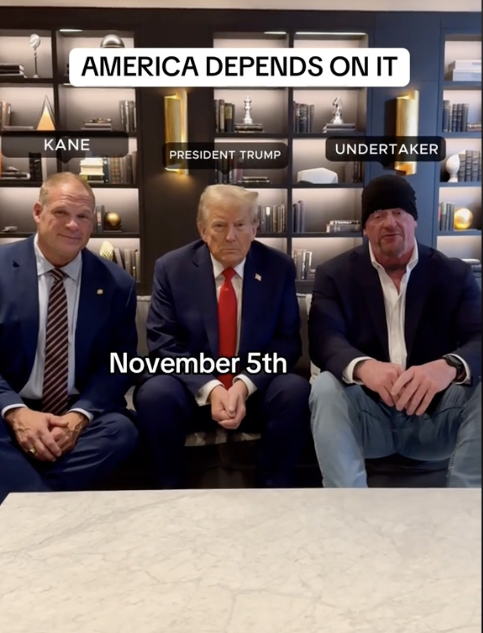 Kane, President Trump, and Undertaker sit together in suits and casual wear. Text reads: &quot;America depends on it. November 5th.&quot;