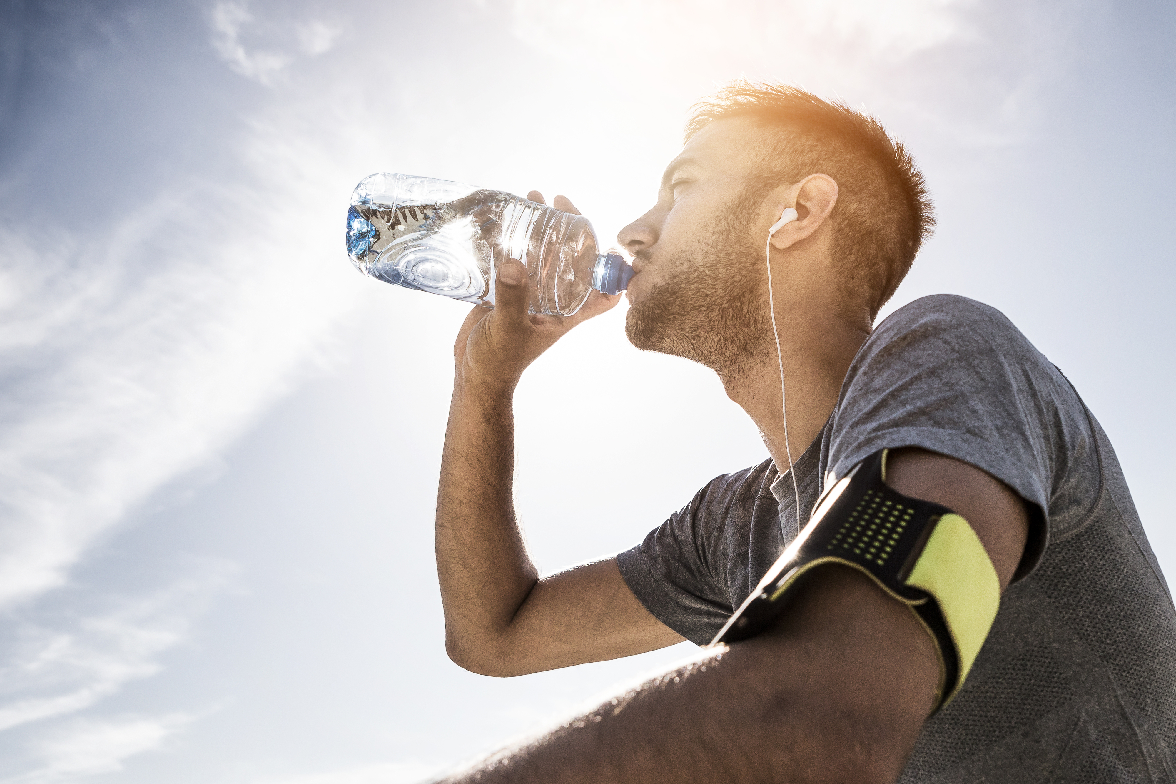 Person enjoying flavored sparkling water outdoors