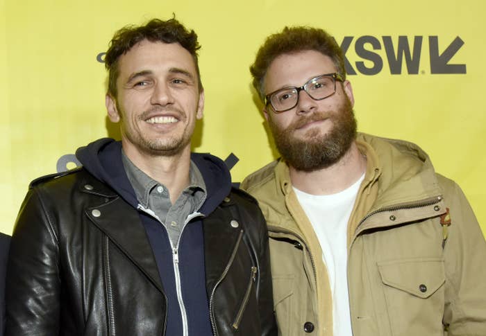 James Franco in a leather jacket over a collared shirt and Seth Rogen in glasses and a casual jacket on the red carpet
