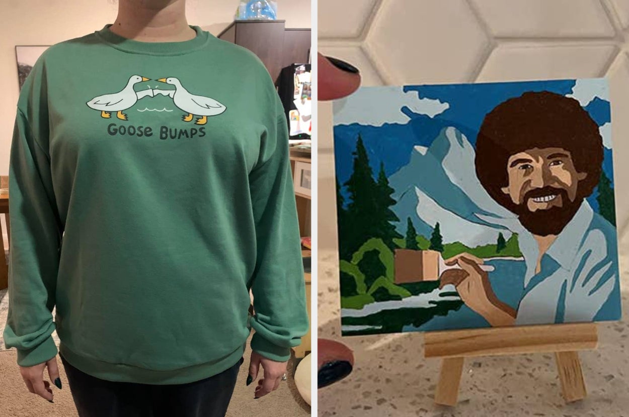 Person wearing a sweatshirt with "Goose Bumps" and two geese printed on it; small painting of a landscape with a smiling Bob Ross