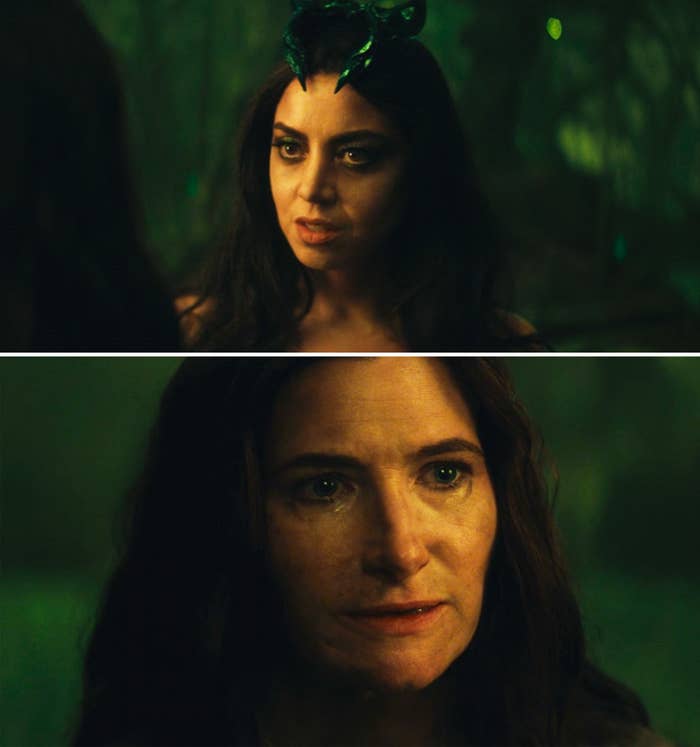 Two movie characters with intense expressions face each other. One has dark hair and a horned headpiece, the other has dark hair and a somber look
