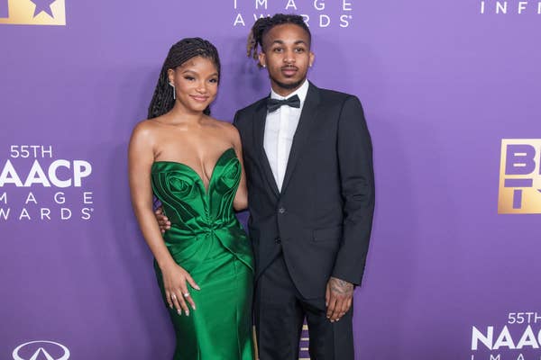 Halle Bailey and DDG on the red carpet. Halle is wearing a strapless dress and DDG is wearing a suit and bow tie