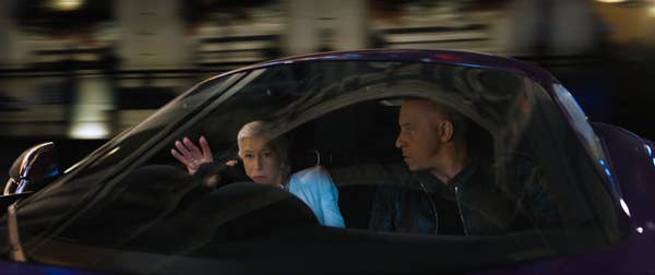 Helen and Vin in a sports car in a scene