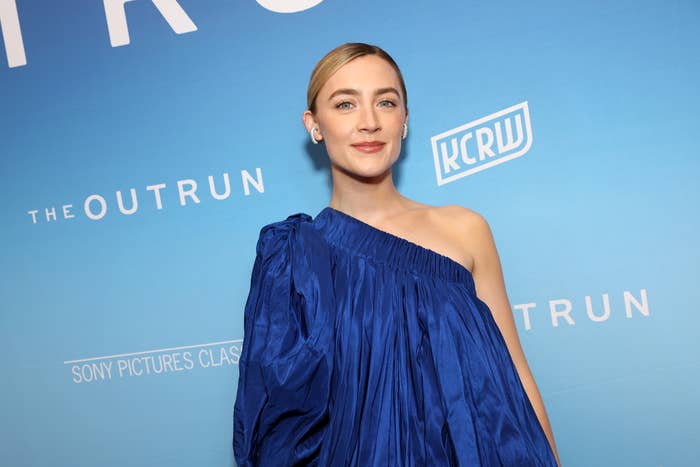 Saoirse Ronan on the red carpet in a one-shoulder dress