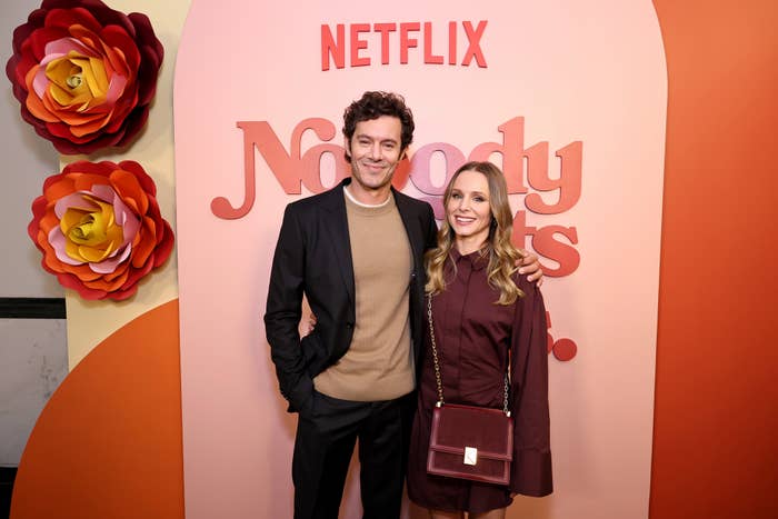 Kristen Bell and Adam Brody pose for a photo.