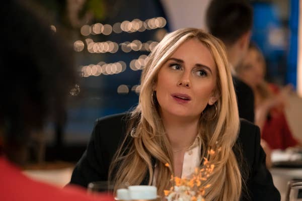 morgan at a dinner table in a scene from nobody wants this
