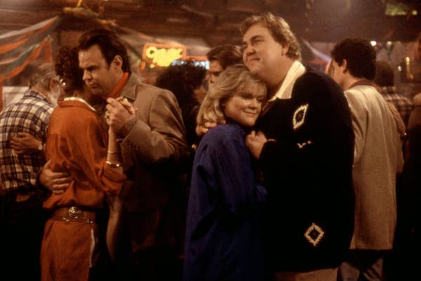 a scene of a couple slow dancing at a party