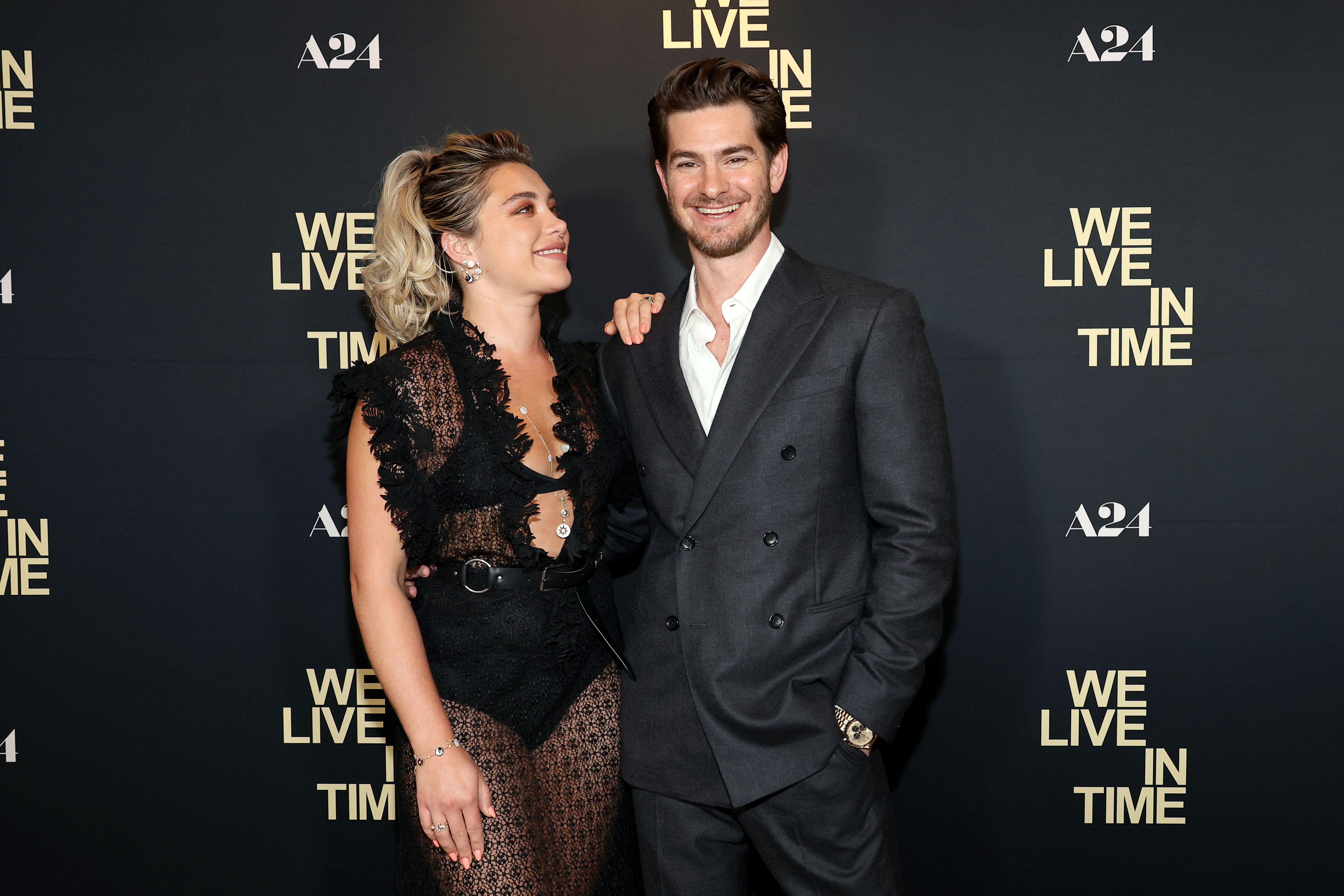 Florence Pugh in a lace gown and Andrew Garfield in a suit at an event for "We Live in Time"