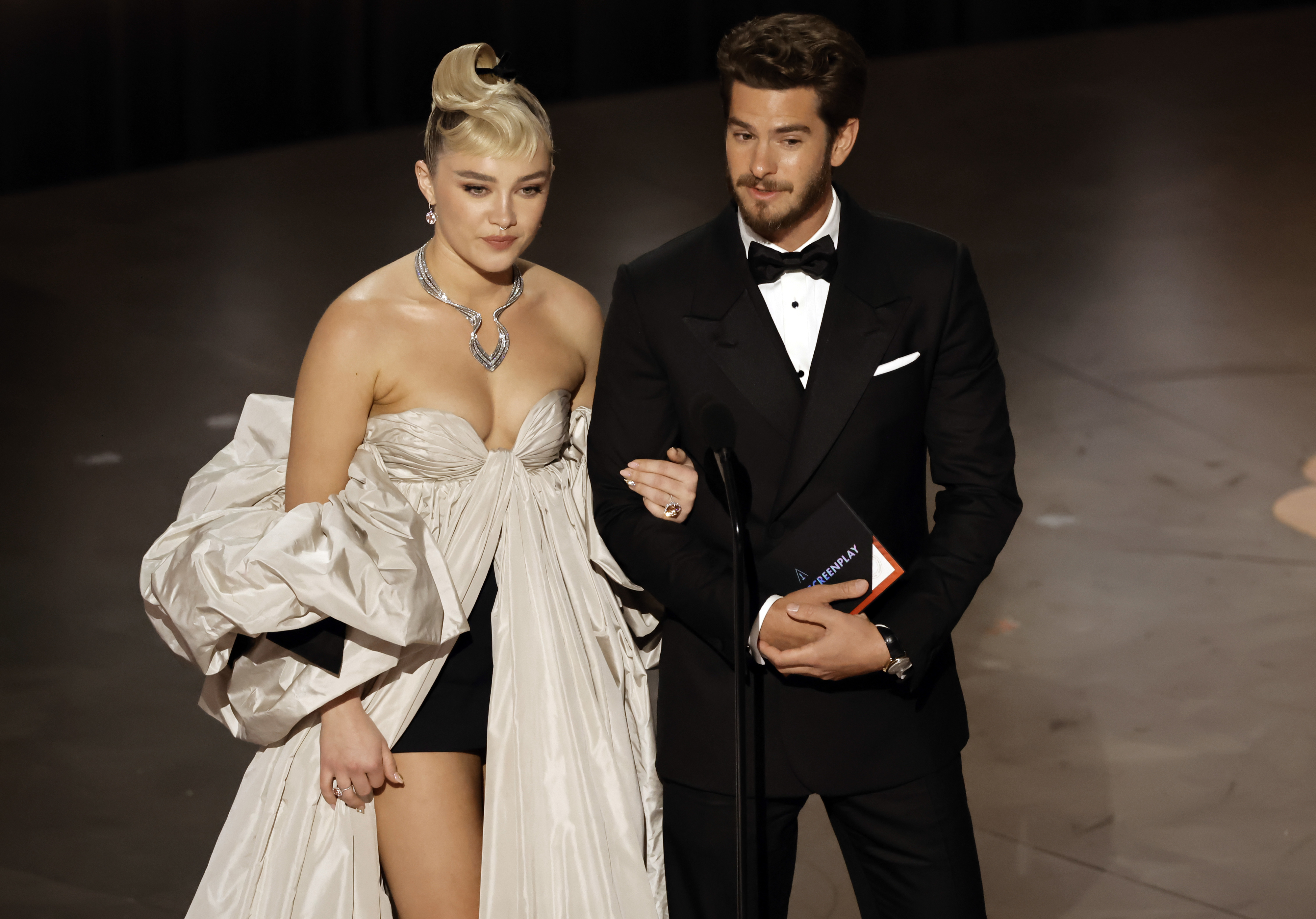 Florence Pugh and Andrew Garfield speak onstage during the Academy Awards in 2023