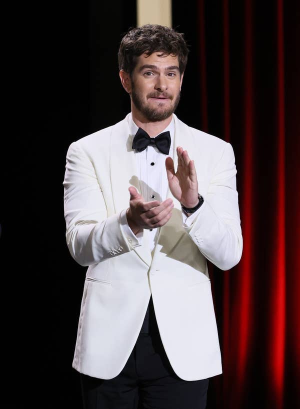Andrew Garfield clapping on stage
