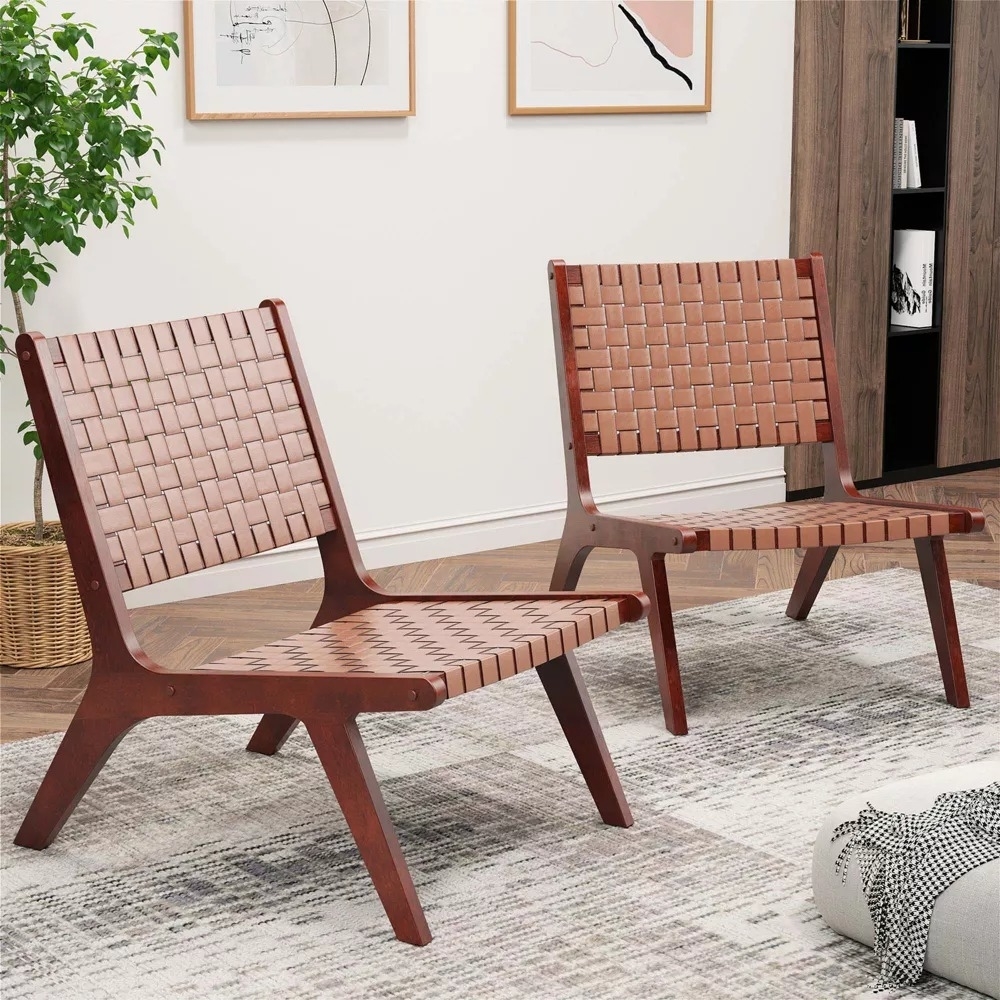 Two mid-century modern woven leather chairs in a living room setting