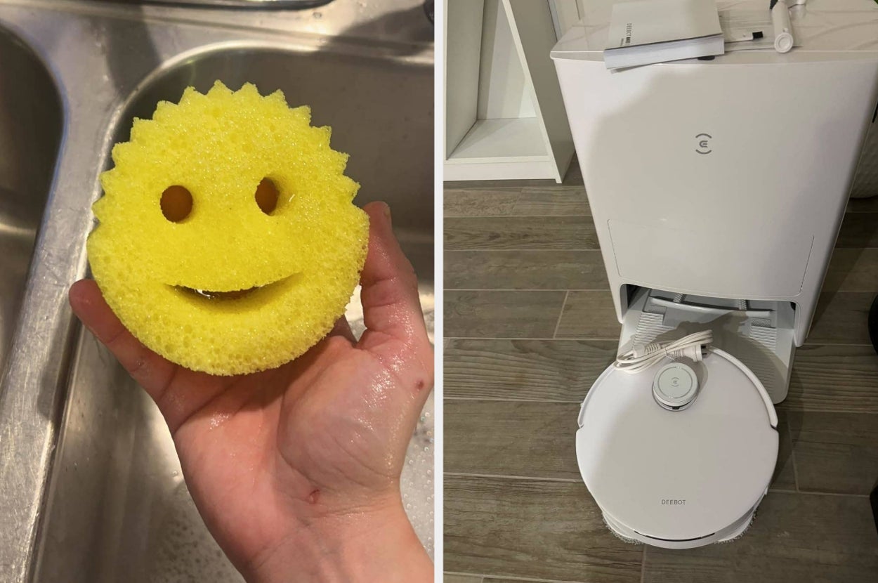 Smiley face sponge held near a sink; robot vacuum docked under a white appliance