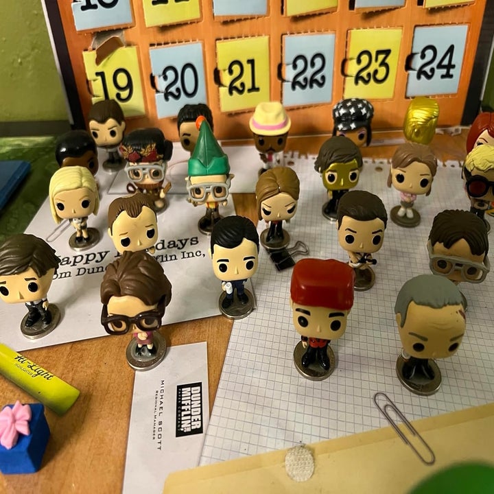 Assorted The Office character Funko Pop! figures arranged on a desk