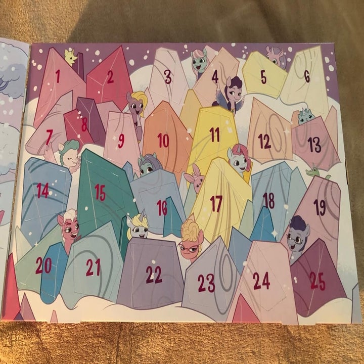 Advent calendar with cartoon animals peeking from numbered sections, 1 to 25