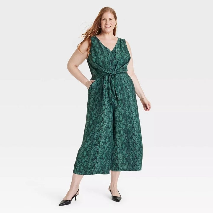 Model wearing green jumpsuit