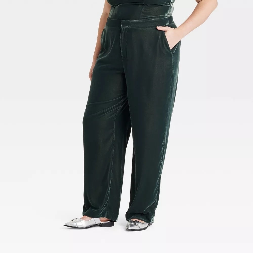 model wearing green pants with silver shoes