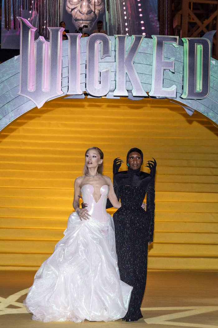 Two individuals on a stage under a