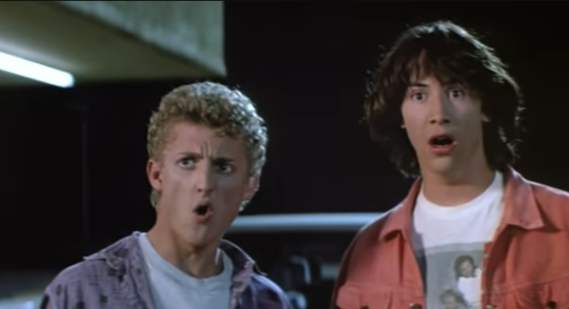 From &quot;Bill &amp;amp; Ted&#x27;s Excellent Adventure&quot;: Two young men with surprised expressions stand side by side, wearing casual &#x27;80s attire