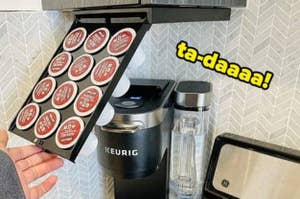 Keurig coffee maker with an open pod holder showing multiple coffee pods, with text saying "ta-daaaa!"