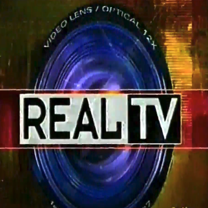 "REAL TV" logo over a stylized camera lens with the text "VIDEO LENS / OPTICAL 1.7X" above