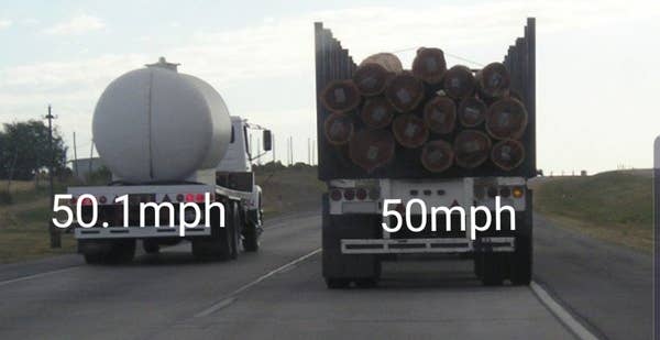 Two trucks on a highway: one has logs and the other a large tank. Truck speeds are labeled as 50 mph and 50.1 mph