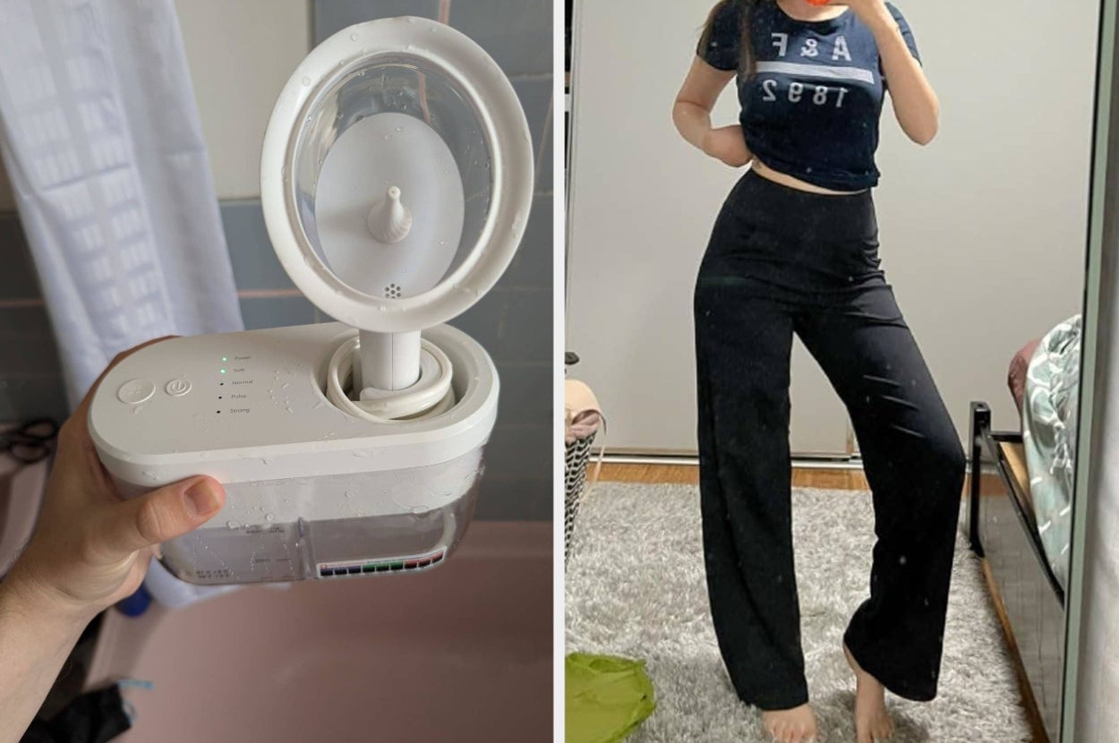 Person holding a facial steamer; woman in a casual black top and wide-legged pants stands in a bedroom