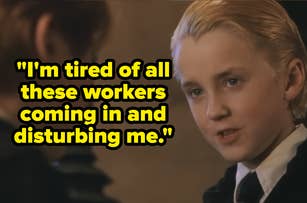 Two young individuals in school uniforms are talking intently inside a room