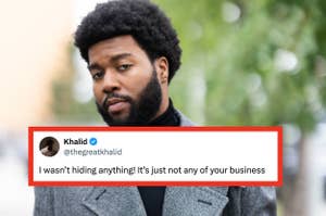 A person wearing a stylish, tailored coat and turtleneck poses outdoors with trees in the background